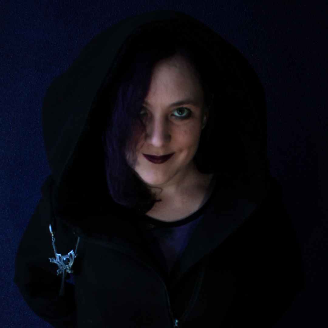 Wianne wearing a hooded goth coat