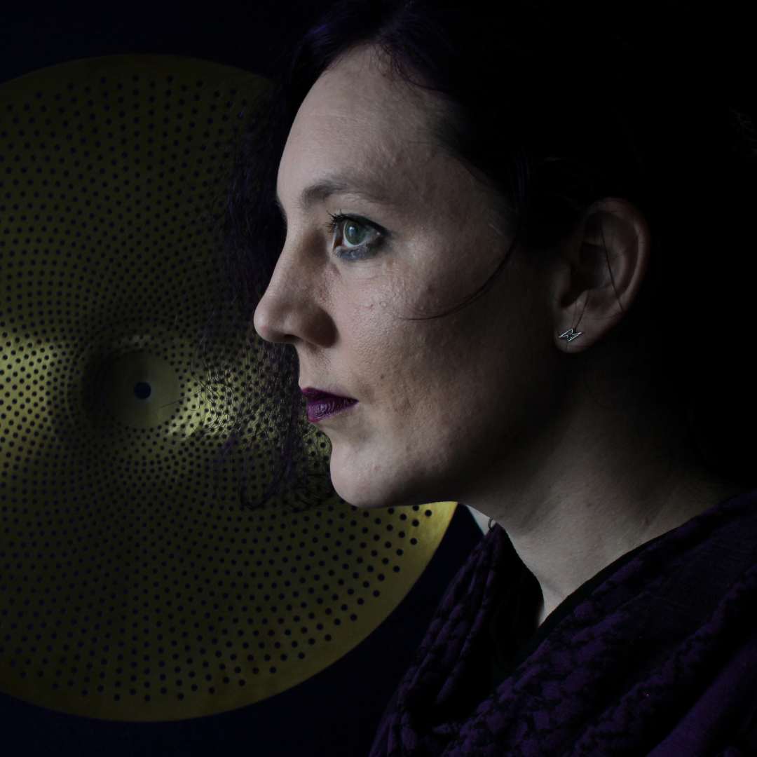 Wianne in front of a ride cymbal